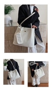 Dettaglio della borsa tote bianca minimalista in pelle con pochette coordinata e logo