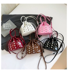 Group display of five studded bucket bags in white, pink, red, brown, and black colors