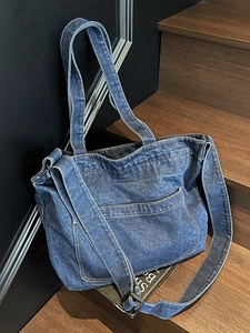 Retro dark blue washed denim tote bag with spacious main compartment and adjustable strap