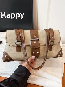 Retro khaki canvas underarm bag with brown leather trim and metal buckle detail