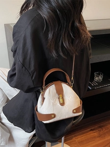 Retro cream monogram crossbody bag with brown leather trim and gold twist lock closure