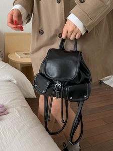 Retro black faux leather backpack with white stitching and metal buckle for women