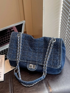 Fashionable dark blue denim tote bag with chain strap and quilted square pattern