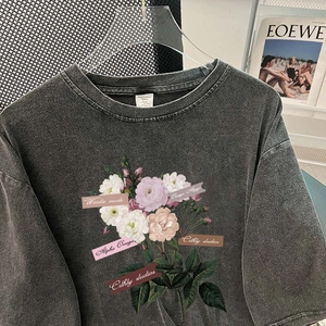 Vintage washed black cotton T-shirt with retro floral print and ribbon details