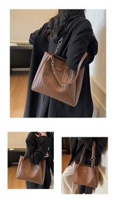 Brown woven tote bag with gold chain strap and vintage commuting style detail