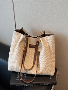 Vintage woven tote bag in cream white with brown leather straps for commuting and daily use