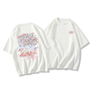 Close-up of white cotton T-shirt featuring cherry blossom and mountain back print