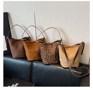 Detailed collection of faux suede bucket bags in leopard print and solid autumn tones