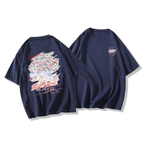 Detail of dark blue oversized cotton T-shirt featuring Japanese street style cherry blossom print