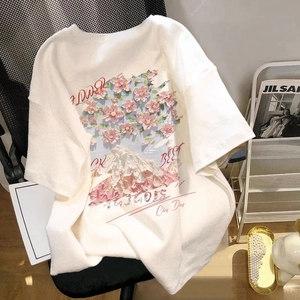 White cotton t-shirt featuring cherry blossom mountain graphic in oversized street style
