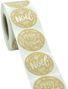Macro shot of circular kraft Christmas roll stickers with Noel and Merry Christmas prints