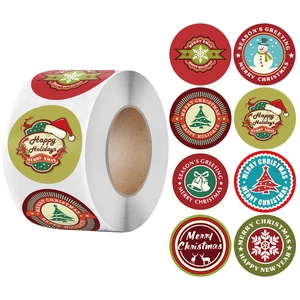 Roll of Merry Christmas stickers with snowflakes, reindeers, and trees for festive sealing
