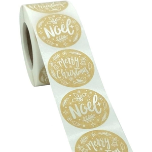 Roll of kraft paper Christmas stickers featuring Noel and Merry Christmas snowflake motifs