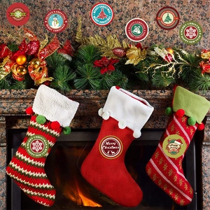 Close-up of knit Christmas stockings with festive patterns and Merry Christmas text decor