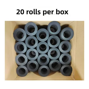 Vertical top view of twenty rolls of black craft paper packed in a cardboard storage box
