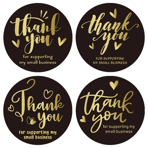 Roll of black and gold Thank You stickers for small business packaging and envelopes