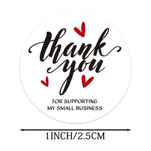 Detail view of 1-inch round Thank You stickers with red hearts for small business