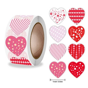 Roll of 1-inch heart-shaped stickers with 8 red and pink patterns for gift sealing
