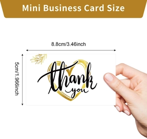 Mini business thank you card with gold heart and leaf details in hand for scale