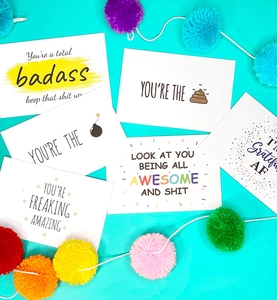 Close-up of motivational thank you cards with modern slang on vibrant teal background