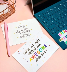 Macro view of inspirational thank you cards with colorful typography and gold stars