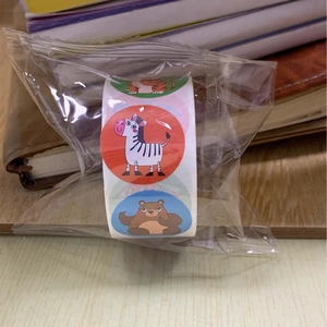 Detail of rolled cartoon animal stickers with zebra and tiger patterns for kids' decoration