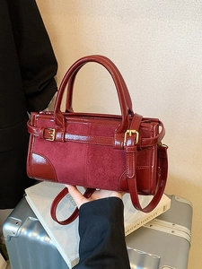 Retro burgundy baguette bag in glossy faux leather and suede for autumn 2025 fashion