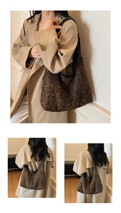 Leopard print hobo bag with black leather straps shown on a model in a beige trench coat