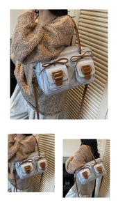 Detail showing dual front pockets with brown trim and sweet bow ties on light blue bag