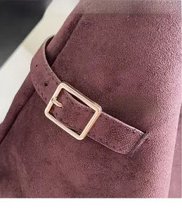 Detail of premium matte purple suede tote bag with elegant gold buckle and fine stitching