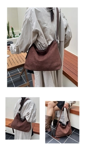 Dettaglio della grande borsa tote marrone in pelle scamosciata con texture opaca e tracolla