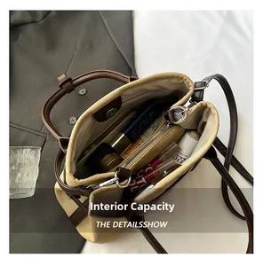 Internal view of beige canvas tote bag with compartments and spacious organizer