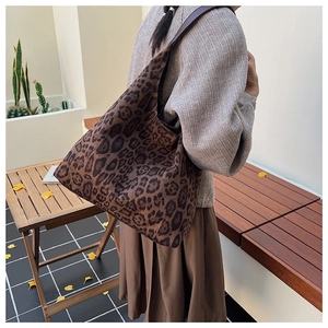 Detail of leopard print faux suede tote bag showing its large capacity and soft texture
