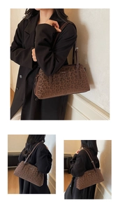 Detailed view of leopard print shoulder bag featuring metal logo and slim leather strap