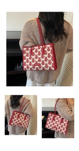 Detail of red 'Double Happiness' jacquard tote bag with stylish leather handles