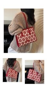Detail of red bridal tote bag with traditional double happiness jacquard and leather strap