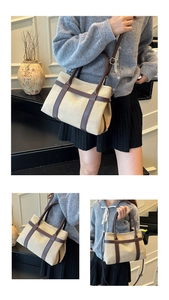 Detail view of beige canvas and brown leather stitching on a large tote handbag