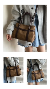 Detail of vintage brown canvas tote bag with leather straps and large capacity
