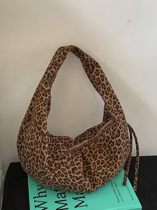 Leopard print faux suede hobo bag with large capacity and crescent dumpling shape design