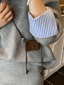 Mini brown suede crossbody coin purse with leather strap and decorative wooden beads