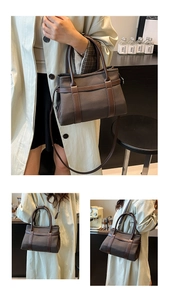 Detail view of large canvas and leather tote bag with sturdy handles and shoulder strap