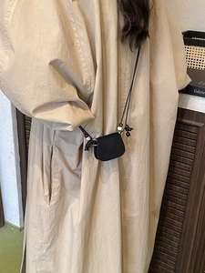 Minimalist black mini saddle bag with unique beaded shoulder strap for autumn fashion