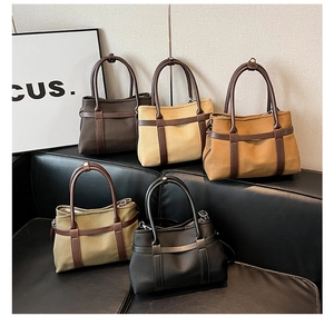 Detailed view of large retro tote bags in canvas and leather for stylish daily commuting