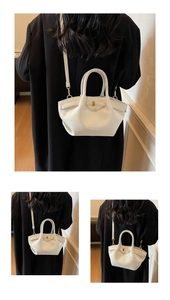 Détail du sac à main en cuir grainé crème avec bord ondulé et boucle dorée chic