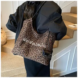 Chic leopard print tote bag styled on model over shoulder in lifestyle setting