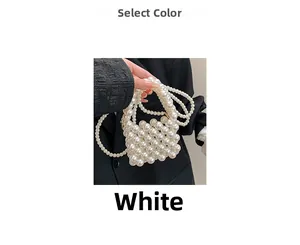 Detail shot of mini pearl woven handbag with elegant handle and long shoulder chain