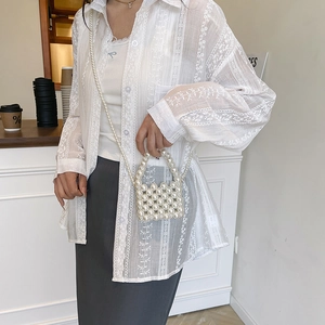 Elegant white pearl woven mini bag with pearl handle and crossbody strap for women