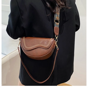 Brown semi-circle saddle bag with beaded trim and patterned wide shoulder strap