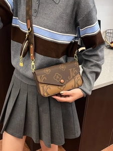 Retro monogram crossbody bag with flap and mini round pouch shown on a model