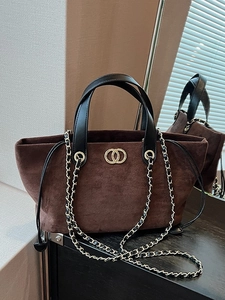 Deep brown suede tote bag with black leather handles and golden double ring buckle